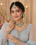 Aqua blue acrylic floral jewellery set - model wearing