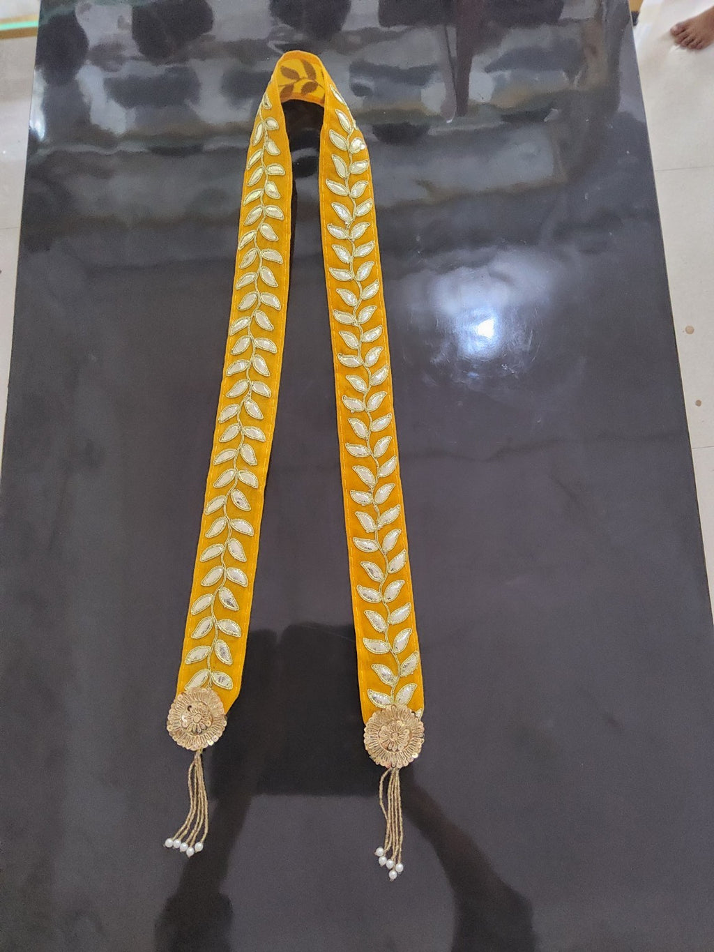 Yellow Barati Swagat Mala with gold leaf work and pearl tassels
